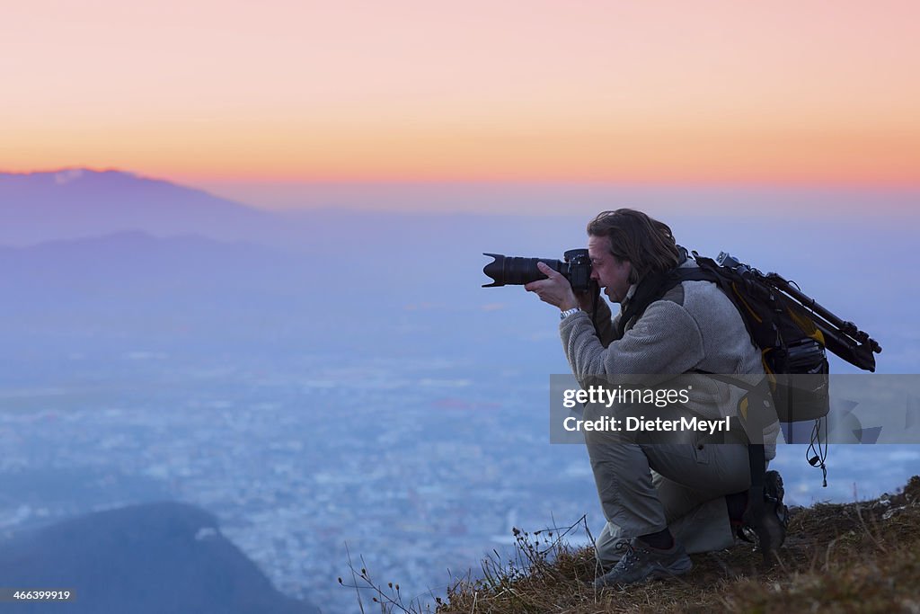 Nature photographer in the mountains over salzburg