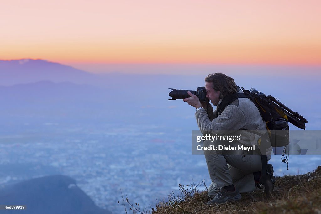 Nature photographer in the mountains  over salzburg