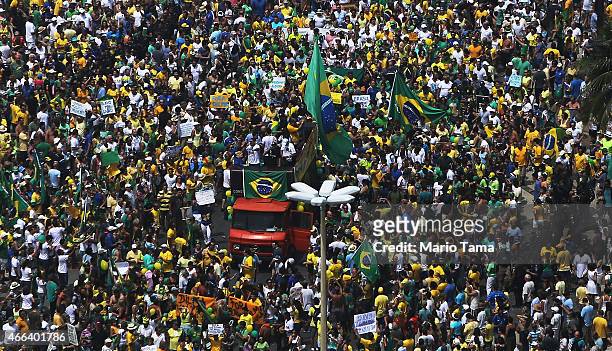 Anti-government protesters march along Copacabana beach on March 15, 2015 in Rio de Janeiro, Brazil. Protests across the country were held today...