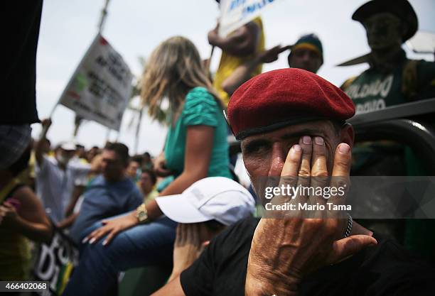 Anti-government protesters march along Copacabana beach on March 15, 2015 in Rio de Janeiro, Brazil. Protests across the country were held today...