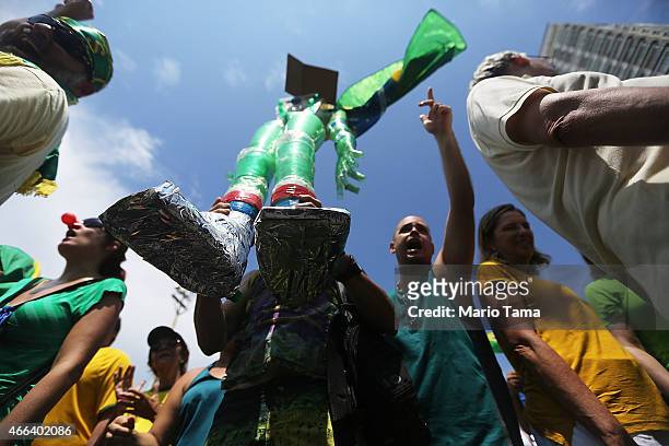 Anti-government protesters march along Copacabana beach on March 15, 2015 in Rio de Janeiro, Brazil. Protests across the country were held today...