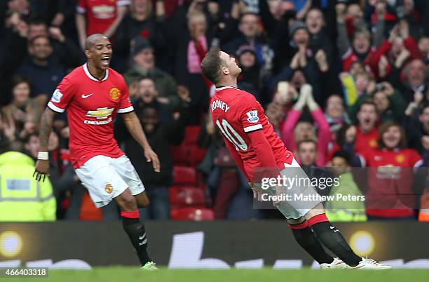 Wayne Rooney of Manchester United celebrates scoring their third goal during the Barclays Premier League match between Manchester United and...