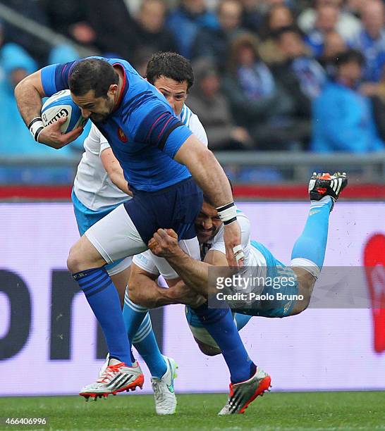 Scott Spedding of France is tackled by Andrea Masi of Italy during the RBS Six Nations match between Italy and France at Stadio Olimpico on March 15,...