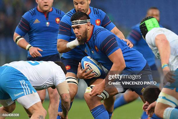 France's lock Romain Taofifenua runs with the ball during the Six Nations international rugby union match between Italy and France on March 15, 2015...