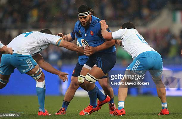 Romain Taofifenua of France is tackled by Quintin Geldenhuys and Andrea Manici during the Six Nations match between Italy and France at the Stadio...