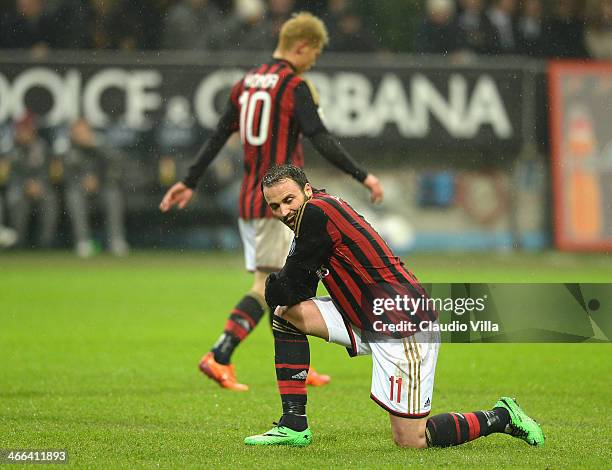 Giampaolo Pazzini and Keisuke Honda of AC Milan dejected during the Serie A match between AC Milan and Torino FC at San Siro Stadium on February 1,...