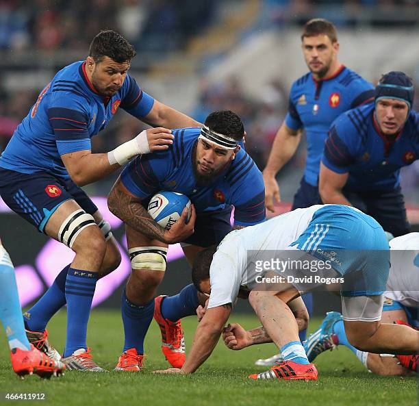 Romain Taofifenua of France is tackled by Samuela Vunisai during the Six Nations match between Italy and France at the Stadio Olimpico on March 15,...