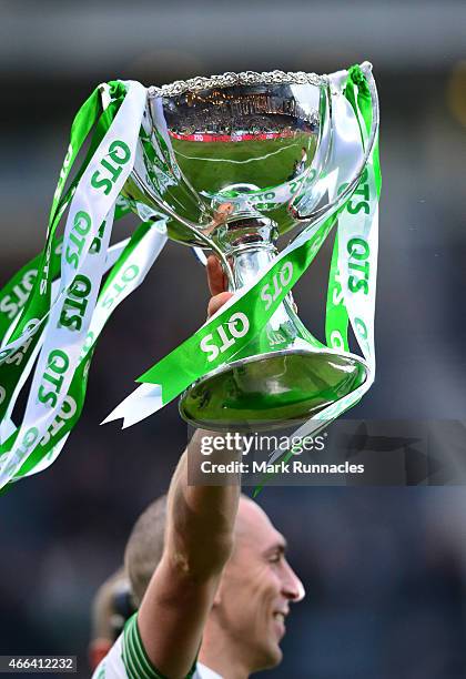 The League Cup trophy held aloft by Celtic captain Scott Brown as the Celtic team celebrate during the Scottish League Cup Final between Dundee...