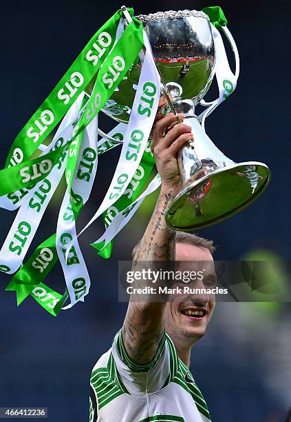 Leigh Griffiths reacts as the Celtic team celebrate after winning the League Cup during the Scottish League Cup Final between Dundee United and...