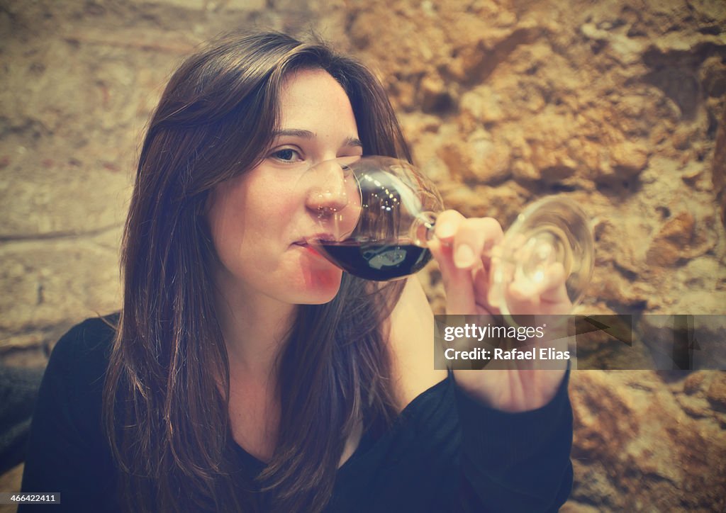 Pretty woman drinking wine