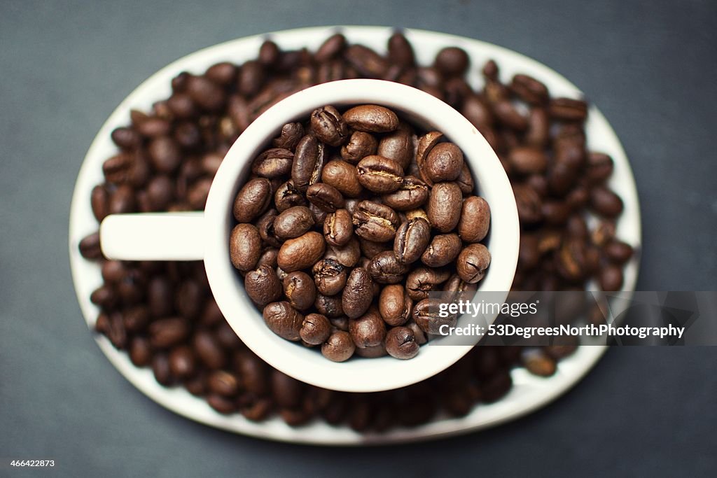 Coffee beans in a cup
