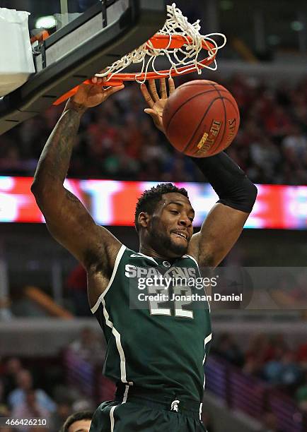 Branden Dawson of the Michigan State Spartans dunks against the Wisconsin Badgers during the Championship game of the 2015 Big Ten Men's Basketball...