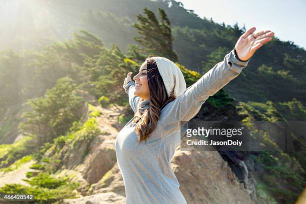 happy hispanic woman outdoors in a beautiful location - bay area stock pictures, royalty-free photos & images
