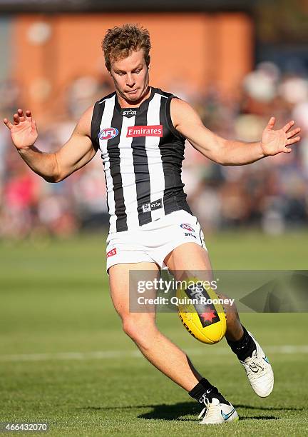 Sam Dwyer of the Magpies kicks during the NAB Challenge AFL match between the Collingwood Magpies and the Carlton Blues at Queen Elizabeth Oval on...