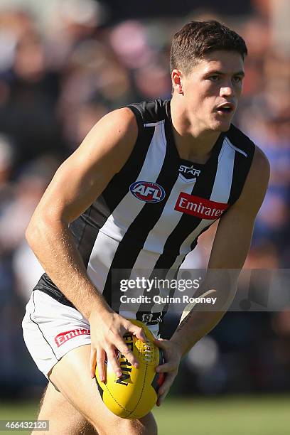 Jack Crisp of the Magpies kicks during the NAB Challenge AFL match between the Collingwood Magpies and the Carlton Blues at Queen Elizabeth Oval on...