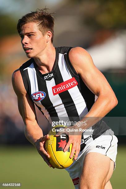 Josh Thomas of the Magpies kicks during the NAB Challenge AFL match between the Collingwood Magpies and the Carlton Blues at Queen Elizabeth Oval on...