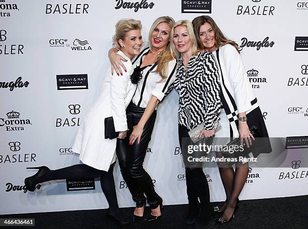 Jennifer Knaeble, Magdalena Brzeska, Aleksandra Bechtel and Sandra Thier attend the Basler fashion show on February 1, 2014 in Dusseldorf, Germany.