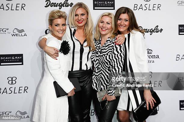 Jennifer Knaeble, Magdalena Brzeska, Aleksandra Bechtel and Sandra Thier attend the Basler fashion show on February 1, 2014 in Dusseldorf, Germany.