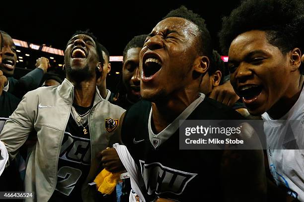 Treveon Graham, Briante Weber, Melvin Johnson and Justin Tillman of the Virginia Commonwealth Rams celebrate after defeating Dayton Flyers in the...