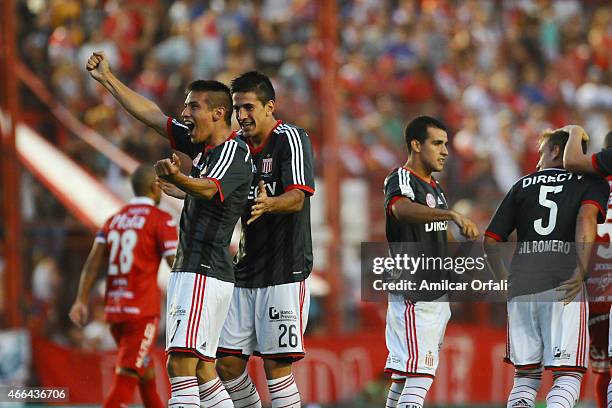 Carlos Auzqui of Estudiantes celebrates with his teammate Diego Mendoza after scoring the second goal of his team during a match between Argentinos...