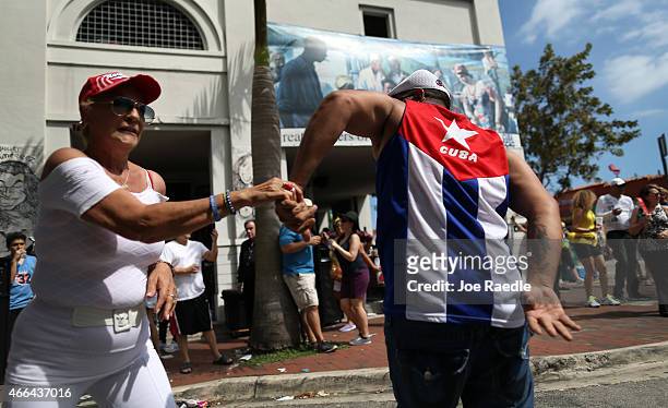 People dance at the Calle Ocho festival in the Little Havana neighborhood on March 15, 2015 in Miami, Florida. The annual festival draws thousands of...