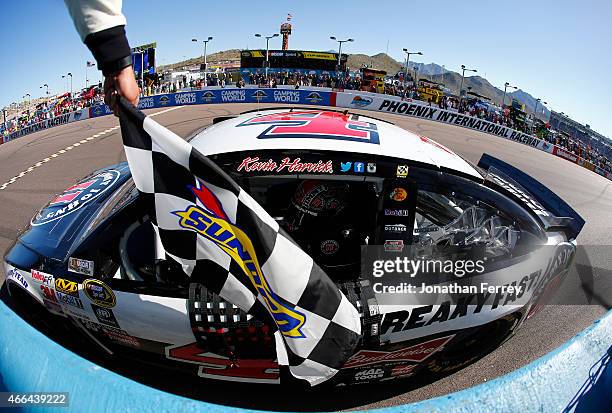 Kevin Harvick, driver of the Jimmy John's/ Budweiser Chevrolet, celebrates after winning the NASCAR Sprint Cup Series CampingWorld.com 500 at Phoenix...