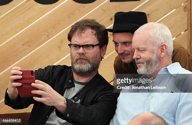 Actors Rainn Wilson, Elijah Wood and David Morse take a selfie at the Roc Nation and Live Nation Raptor House for AOL BUILD on March 15, 2015 in...