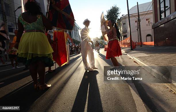 Revelers march in the first street parade of the 2014 Carnival season through the historic Afro-Brazilian port district during the Circuito da Liga...