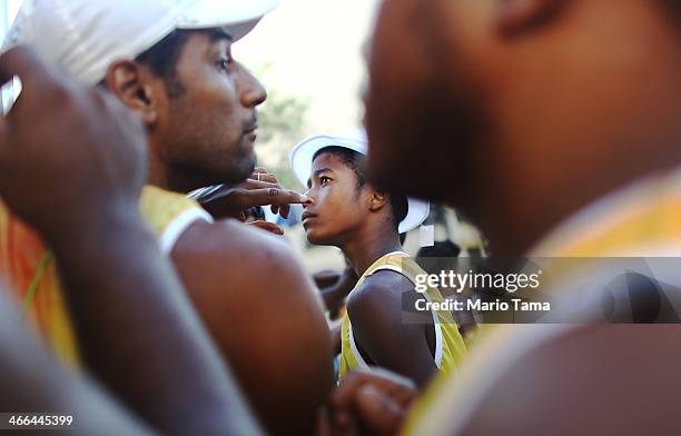 Drummer David Peres and others prepare to march in the first street parade of the 2014 Carnival season through the historic Afro-Brazilian port...