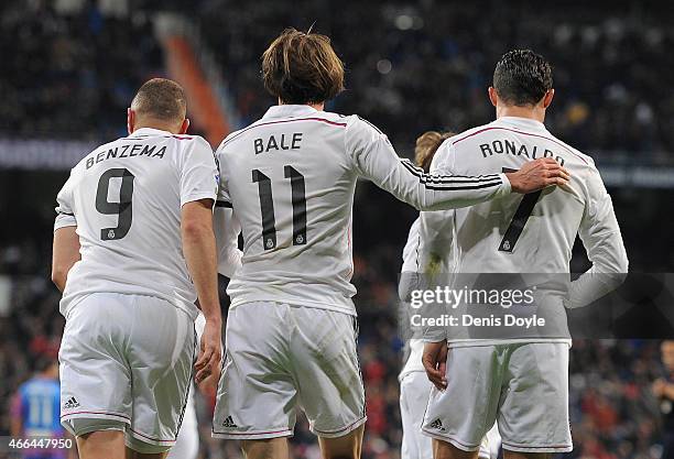 Gareth Bale of Real Madrid celebrates with Cristiano Ronaldo and Karim Benzema after scoring Real's opening goal during the La Liga match between...