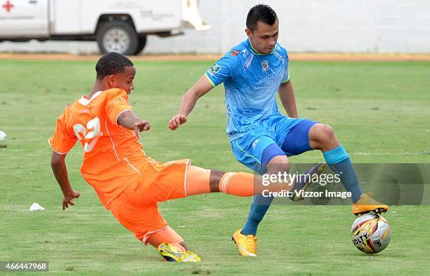 Wilson Meza player of Jaguares FC vies for the ball with Juan Camilo Zapata player of Envigado FC during a match between Jaguares and Envigado as...