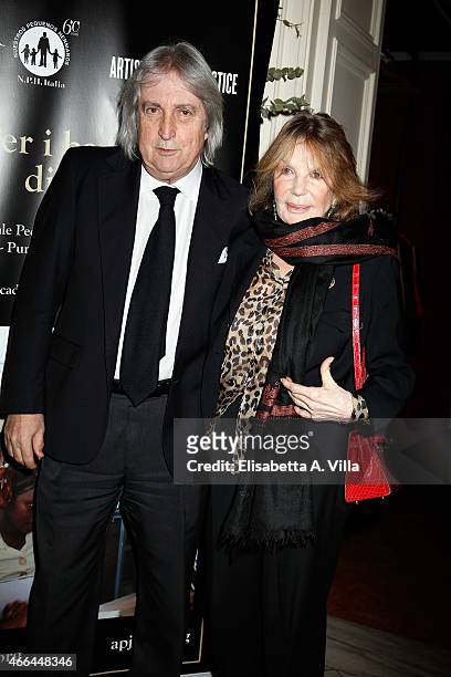 Enrico Vanzina and wife Federica Burger attend the charity dinner organized by Fondazione Rava for the children of Haiti at Villa Letitia on March...