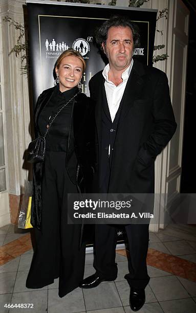 Paolo Sorrentino and wife Daniela D'Antonio attend the charity dinner organized by Fondazione Rava for the children of Haiti at Villa Letitia on...