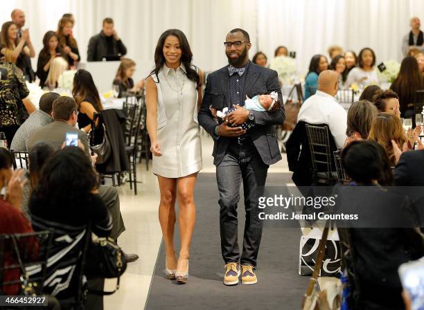 Morrisa Jenkins and Malcolm Jenkins walk the runway at the Saks Fifth Avenue And Off The Field Players' Wives Association Charitable Fashion Show on...
