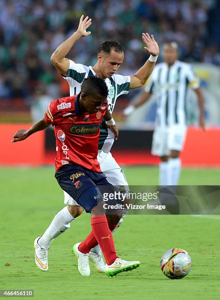 Alejandro Guerra player of Atletico Nacional fights for the ball with Didier Moreno player of Deportivo Independiente Medellin during a match between...