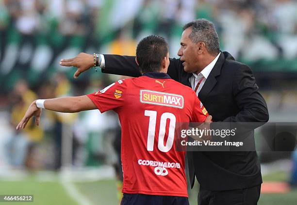 Hernan Torres coach of Deportivo Independiente Medellin gives instructions to Daniel Hernandez during a match between Nacional and Medillin as part...