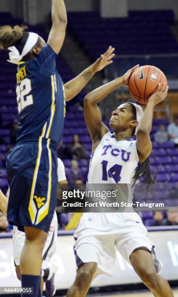 Texas Christian's Zahna Medley takes shot as West Virginia's Linda Stepney defends in the first half at the Daniel-Meyer Coliseum in Fort Worth,...