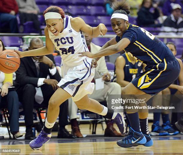 Texas Christian's Natalie Ventress, left, drives the ball past West Virginia's Linda Stepney in the first half at the Daniel-Meyer Coliseum in Fort...