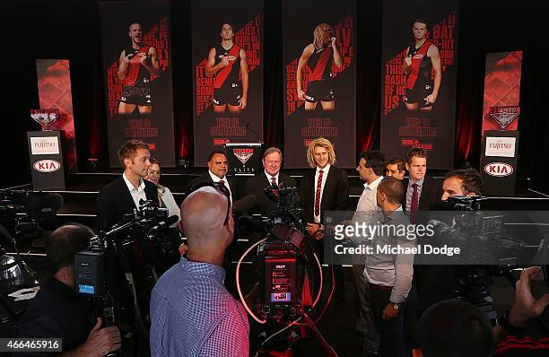 Bombers legend Kevin Sheedy speaks to media next to Michael Long and Dyson Heppell during the Essendon Bombers 2015 AFL season launch at Luminare on...