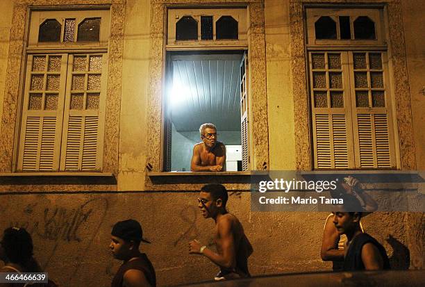 Revelers march in the first street parade of the 2014 Carnival season through the historic Afro-Brazilian port district during the Circuito da Liga...