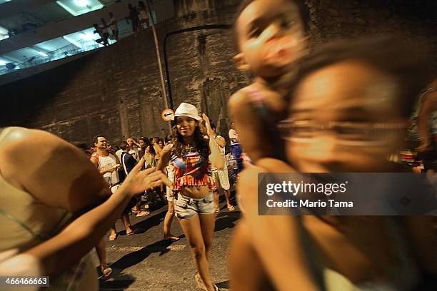 Revelers march in the first street parade of the 2014 Carnival season through the historic Afro-Brazilian port district during the Circuito da Liga...