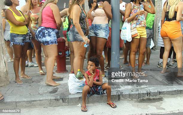 Revelers gather at the first street parade of the 2014 Carnival season through the historic Afro-Brazilian port district during the Circuito da Liga...