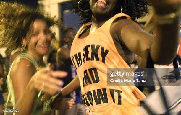 Revelers dance at the first street parade of the 2014 Carnival season through the historic Afro-Brazilian port district during the Circuito da Liga...