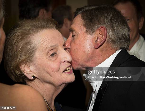 Former Secretary of State Madeleine Albright gets a peck on the cheek before the Gridiron Club Dinner at the Renaissance Hotel in Washington, D.C. On...