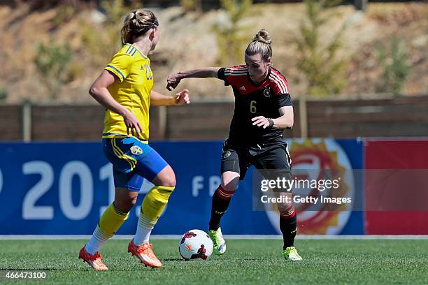 Simone Laudehr of Germany challenges Elin Rubensson of Sweden during the Women's Algarve Cup 3rd place match between Sweden and Germany at Municipal...