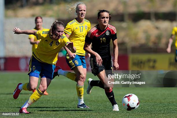 Emma Berlund of Sweden and Fatmire Alushi of Germany running for the ball during the Women's Algarve Cup 3rd place match between Sweden and Germany...