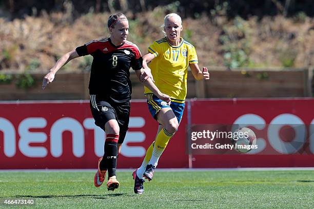 Lena Petermann of Germany challenges Caroline Seger of Sweden during the Women's Algarve Cup 3rd place match between Sweden and Germany at Municipal...