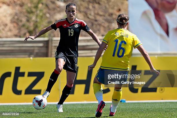 Fatmire Alushi of Germany challenged by Lina Nilsson of Sweden during the Women's Algarve Cup 3rd place match between Sweden and Germany at Municipal...