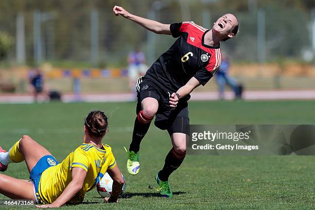 Simone Laudehr of Germany sofers fault by Lina Nilsson of Swedenduring the Women's Algarve Cup 3rd place match between Sweden and Germany at...