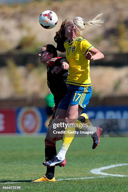 Sara Dabritz of Germany challenged by Caroline Seger of Sweden during the Women's Algarve Cup 3rd place match between Sweden and Germany at Municipal...